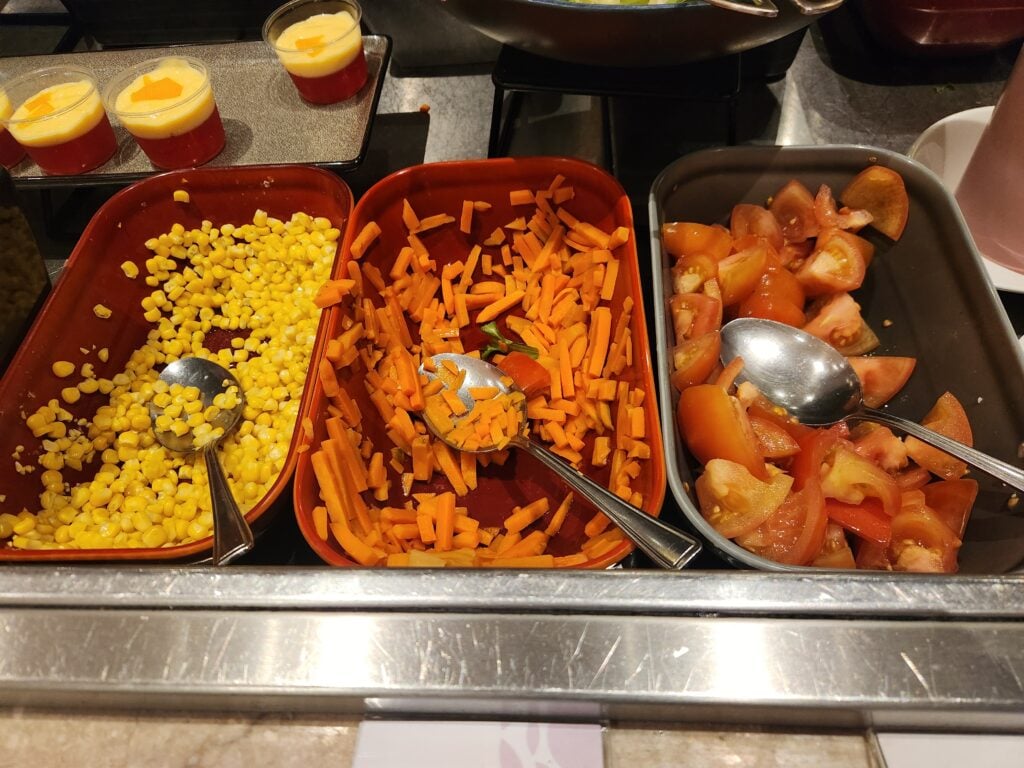Plaza Premium Lounge London Heathrow T2 Food and Nutrition Review - Plaza Premium Lounge London Heathrow T2 Food Salad buffet with corn carrot and tomato Plaza Premium Lounge London Heathrow T2