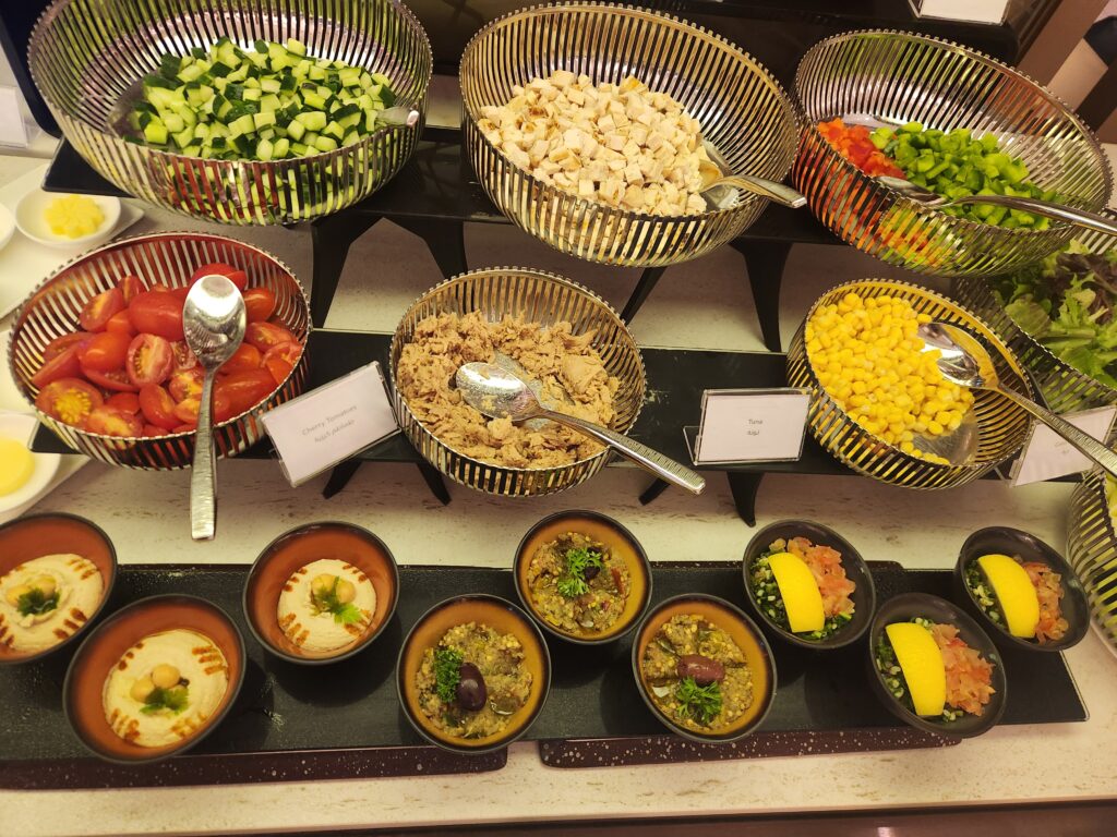 Is Emirates, Qatar or Qantas the best lounge for food in T1 Changi Airport, Singapore? - best lounge for food in T1 Changi Salad buffet Qatar Lounge Singapore